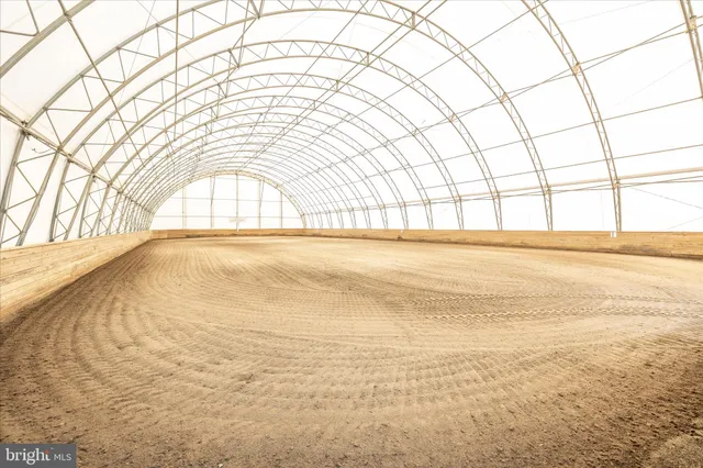 a view of a back yard of a building with a swimming pool