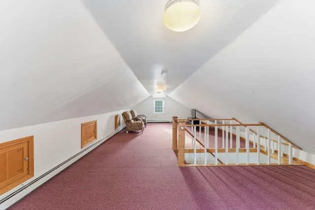 a view of an entryway wooden floor and windows