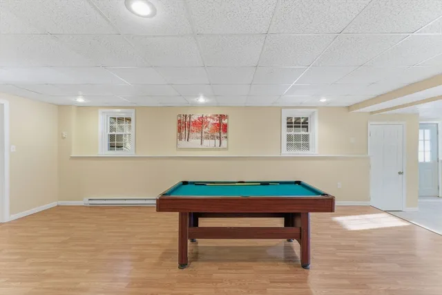 a room with furniture and pool table