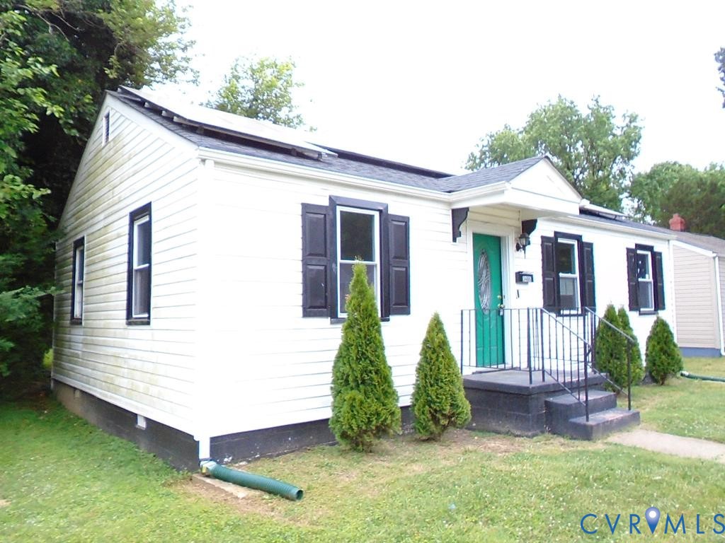3406 Mike Road Richmond, VA 23234 - Photo 2 of 15 White siding exterior with black shutters and a vi