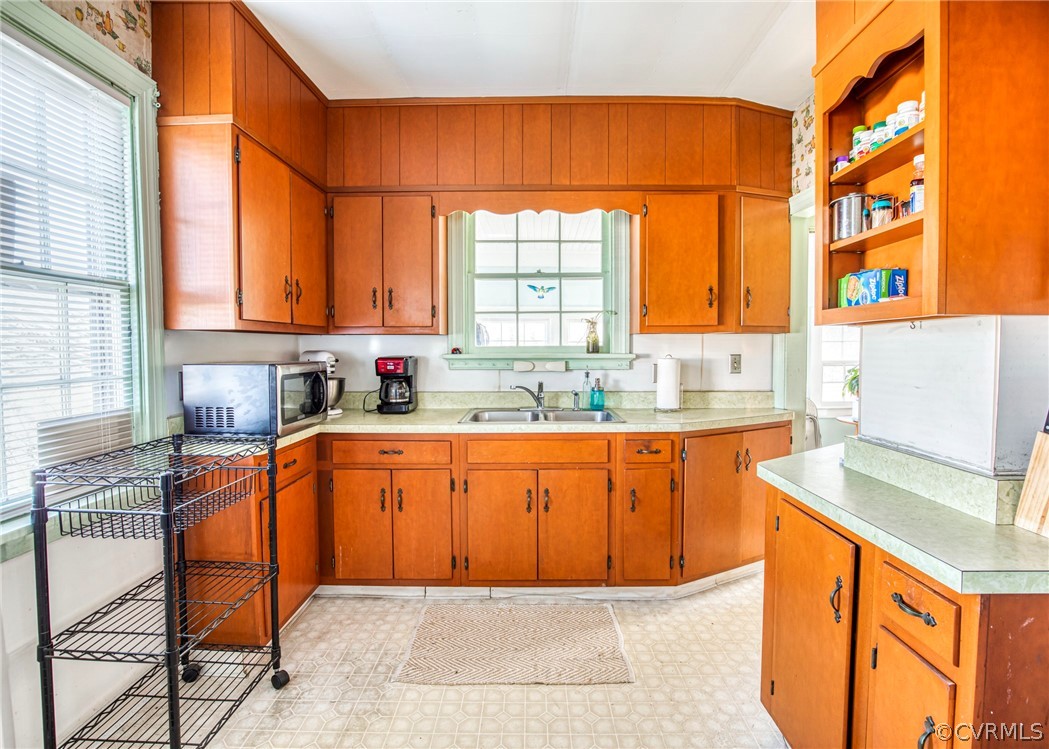 4830 Three Chopt Road Louisa, VA 23093 - Photo 11 of 27 a kitchen with stainless steel appliances granite countertop a sink a stove and a refrigerator