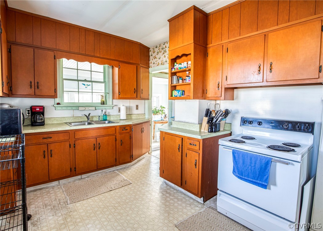4830 Three Chopt Road Louisa, VA 23093 - Photo 12 of 27 a kitchen with stainless steel appliances granite countertop a stove a sink and a refrigerator