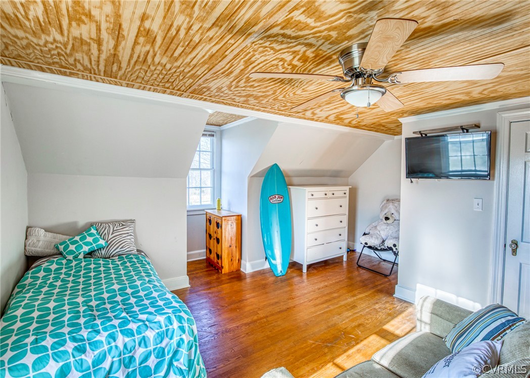 4830 Three Chopt Road Louisa, VA 23093 - Photo 16 of 27 a bedroom with a bed and wooden floor