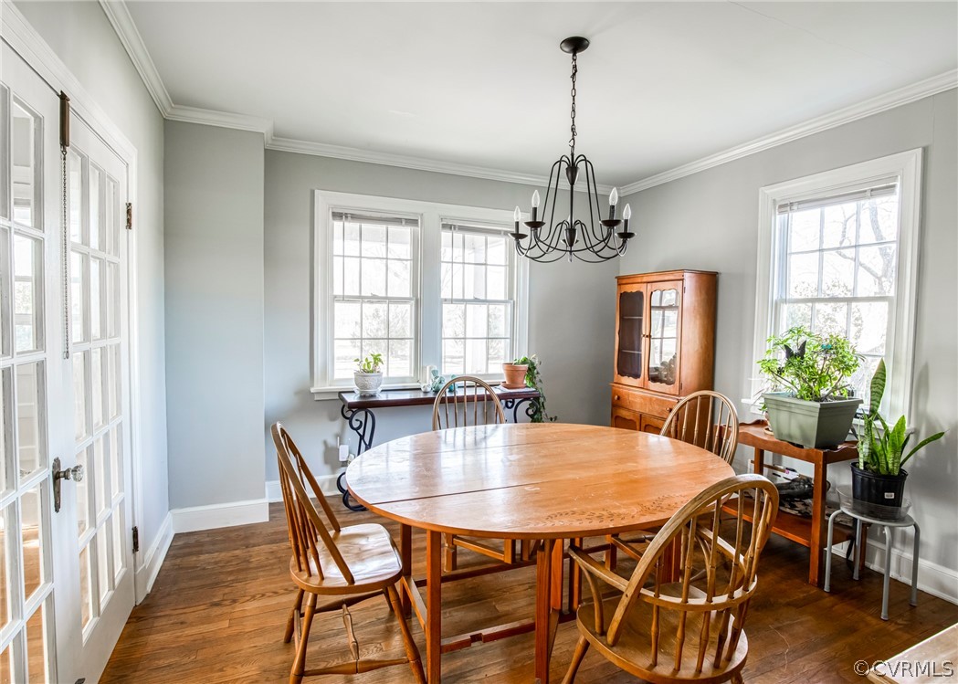 4830 Three Chopt Road Louisa, VA 23093 - Photo 8 of 27 a dining room with furniture a chandelier and wooden floor