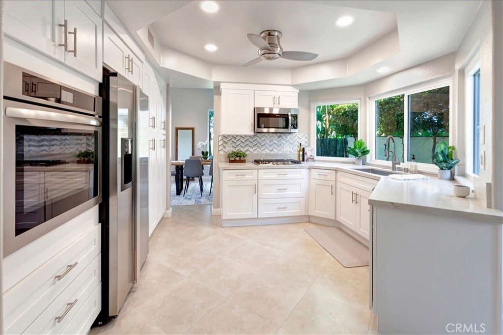 26 Imperatrice Dana Point, CA 92629 - Photo 13 of 58 a large kitchen with cabinets and stainless steel appliances
