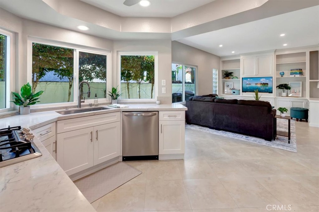 26 Imperatrice Dana Point, CA 92629 - Photo 14 of 58 a large white kitchen with a large window and stainless steel appliances