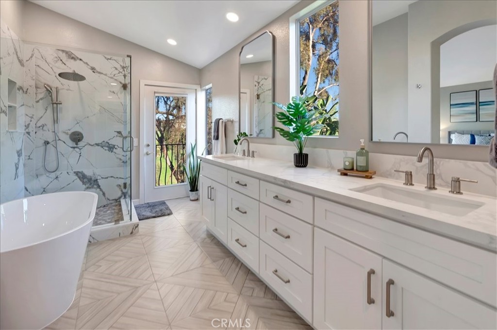 26 Imperatrice Dana Point, CA 92629 - Photo 19 of 58 a bathroom with a double vanity sink mirror and shower