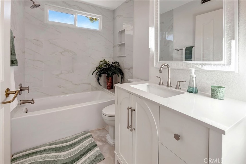 26 Imperatrice Dana Point, CA 92629 - Photo 22 of 58 a bathroom with a sink a toilet and shower