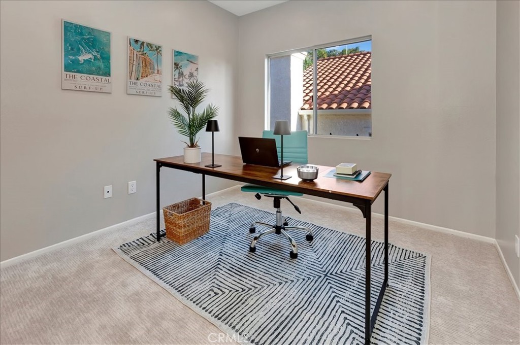 26 Imperatrice Dana Point, CA 92629 - Photo 23 of 58 a bedroom with a bed and wooden floor