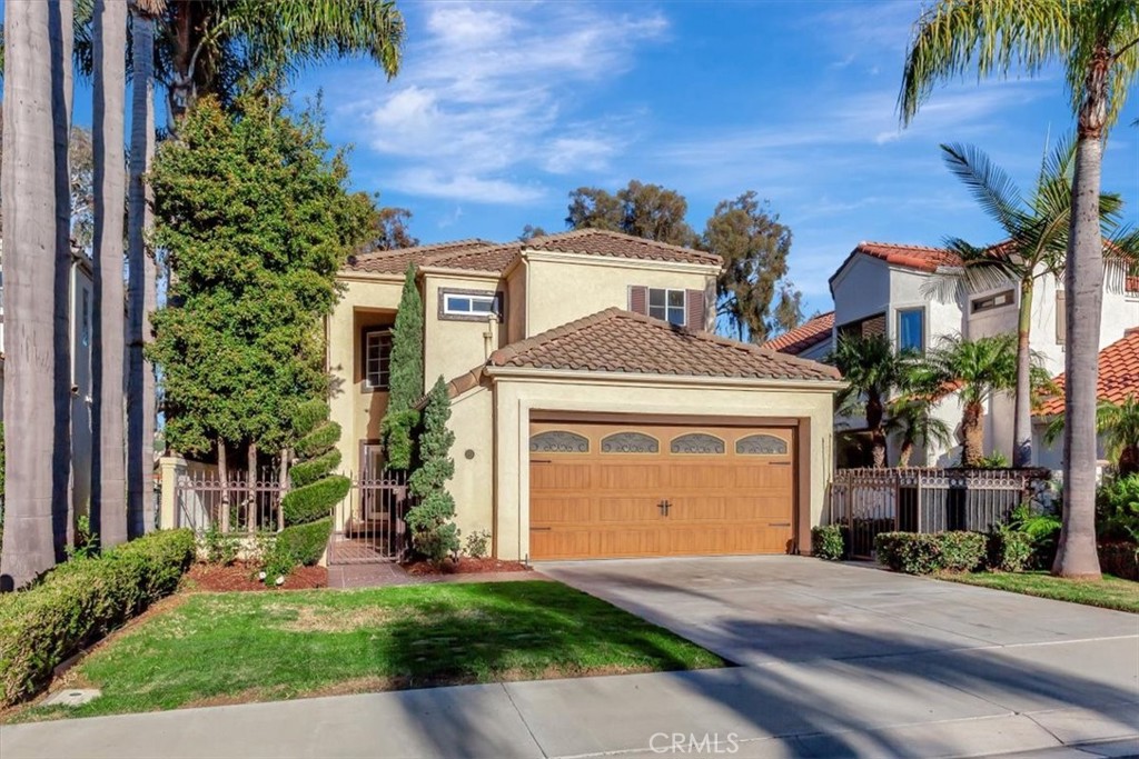 26 Imperatrice Dana Point, CA 92629 - Photo 30 of 58 a front view of a house with a yard and garage