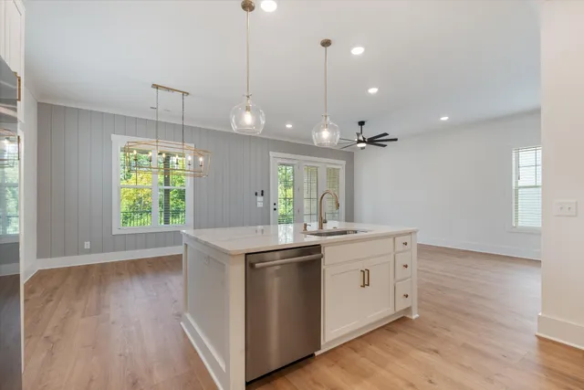 a large kitchen with stainless steel appliances kitchen island a large island in the center