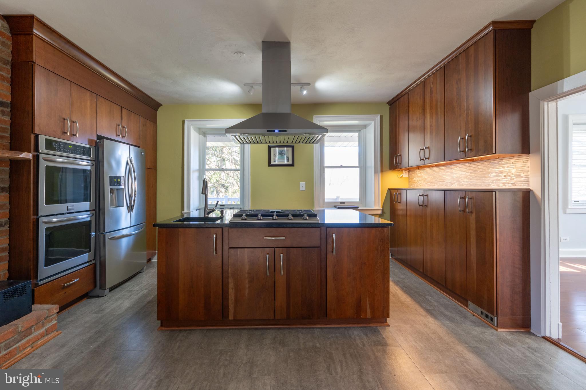 1603 Messiah Church Road Bedford, PA 15522 - Photo 13 of 114 a kitchen with granite countertop wooden cabinets a microwave a stove and a refrigerator