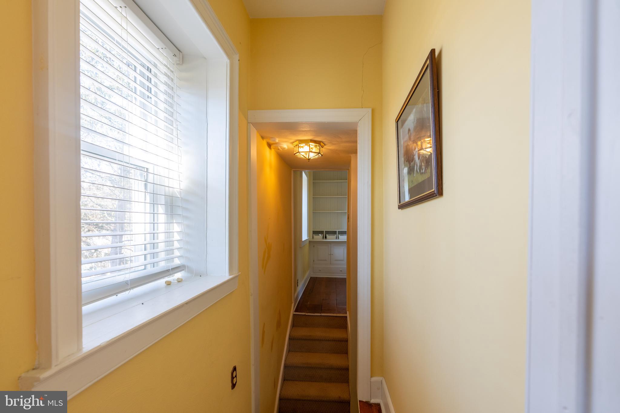 1603 Messiah Church Road Bedford, PA 15522 - Photo 25 of 114 a view of a hallway with wooden floor and stairs