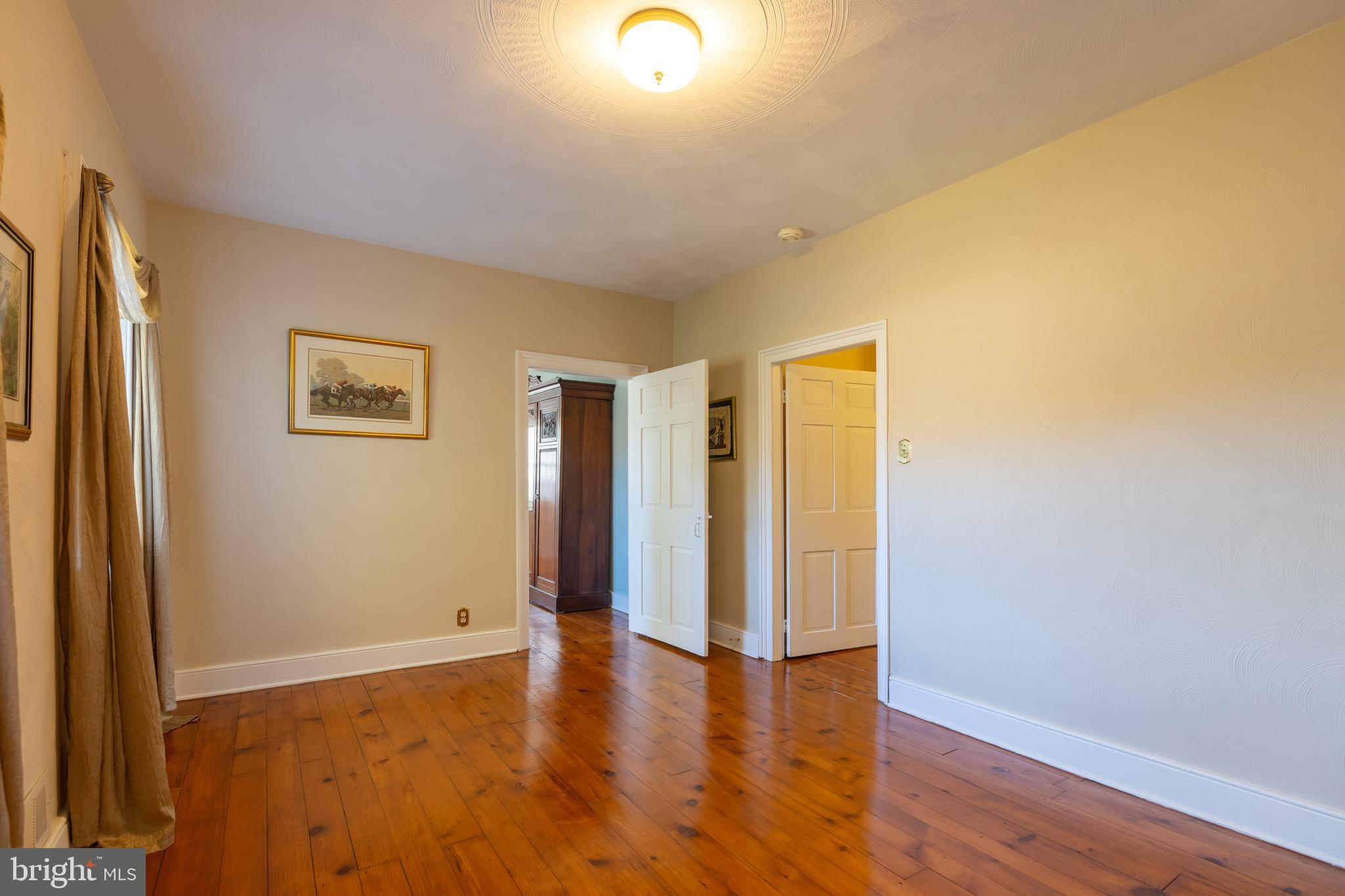 1603 Messiah Church Road Bedford, PA 15522 - Photo 33 of 114 a view of an empty room with wooden floor and a window