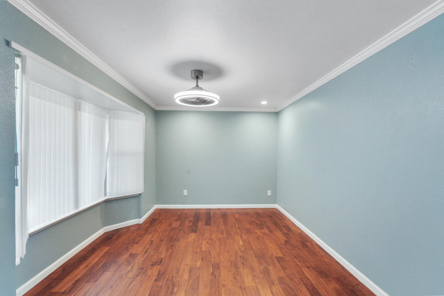 728 R Street Newman, CA 95360 - Photo 6 of 14 a view of empty room with wooden floor