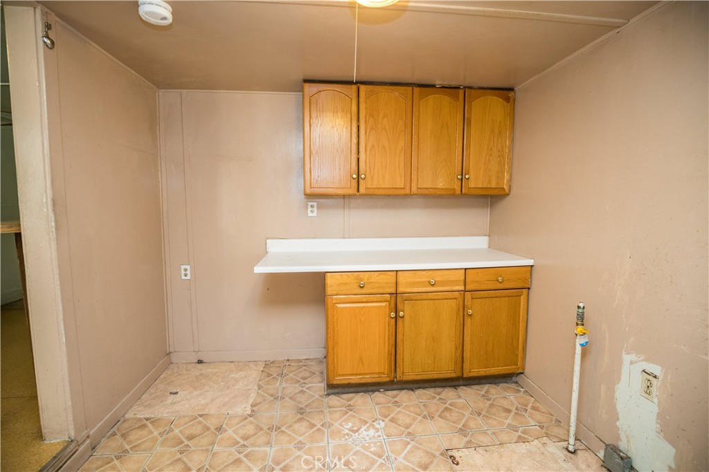 1122 N Street Merced, CA 95341 - Photo 11 of 33 a bathroom with a granite countertop sink and a mirror