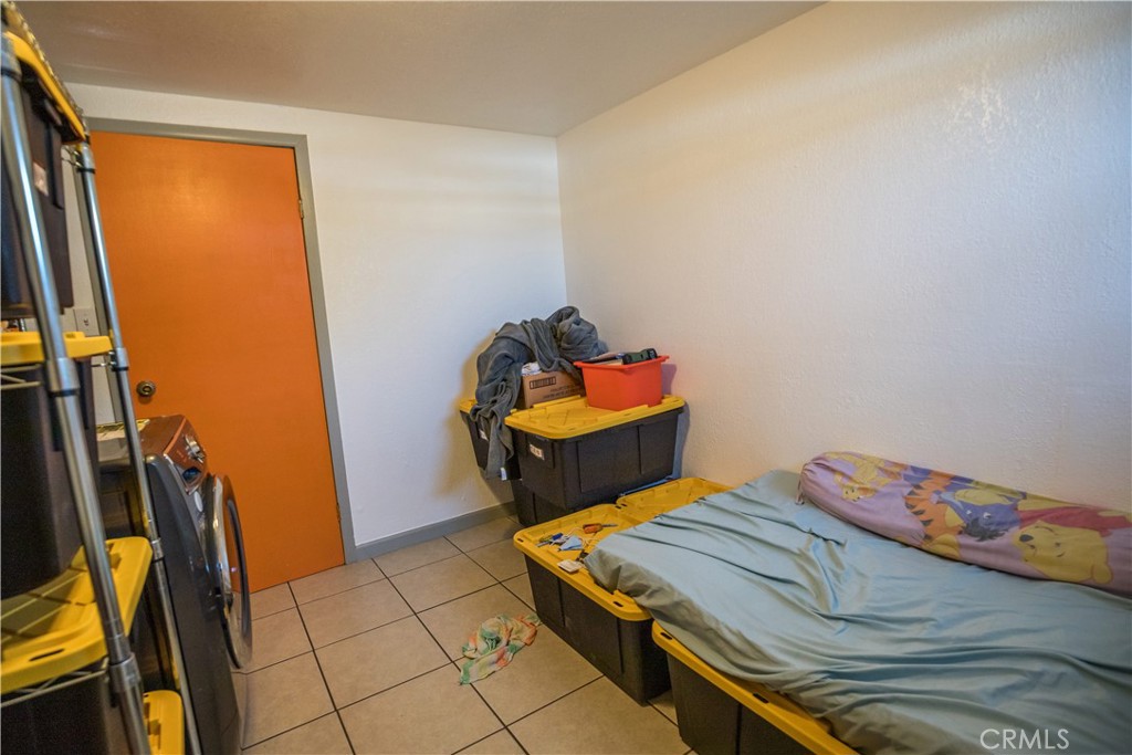 1122 N Street Merced, CA 95341 - Photo 33 of 33 a bedroom with a bed and teddy bear on bed