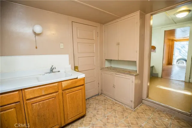 a utility room with cabinets washer and dryer