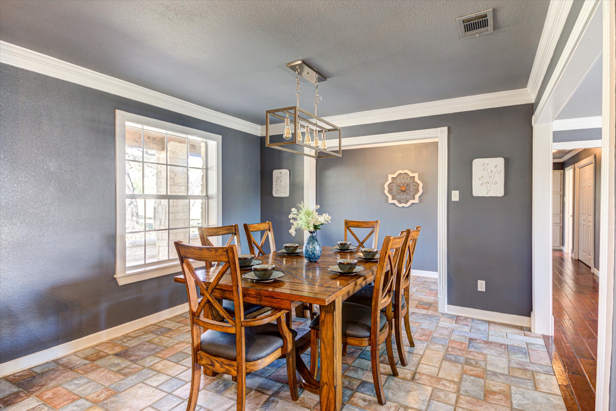 13423 Trail Driver Street Austin, TX 78737 - Photo 11 of 40 a dining room with furniture a chandelier and window