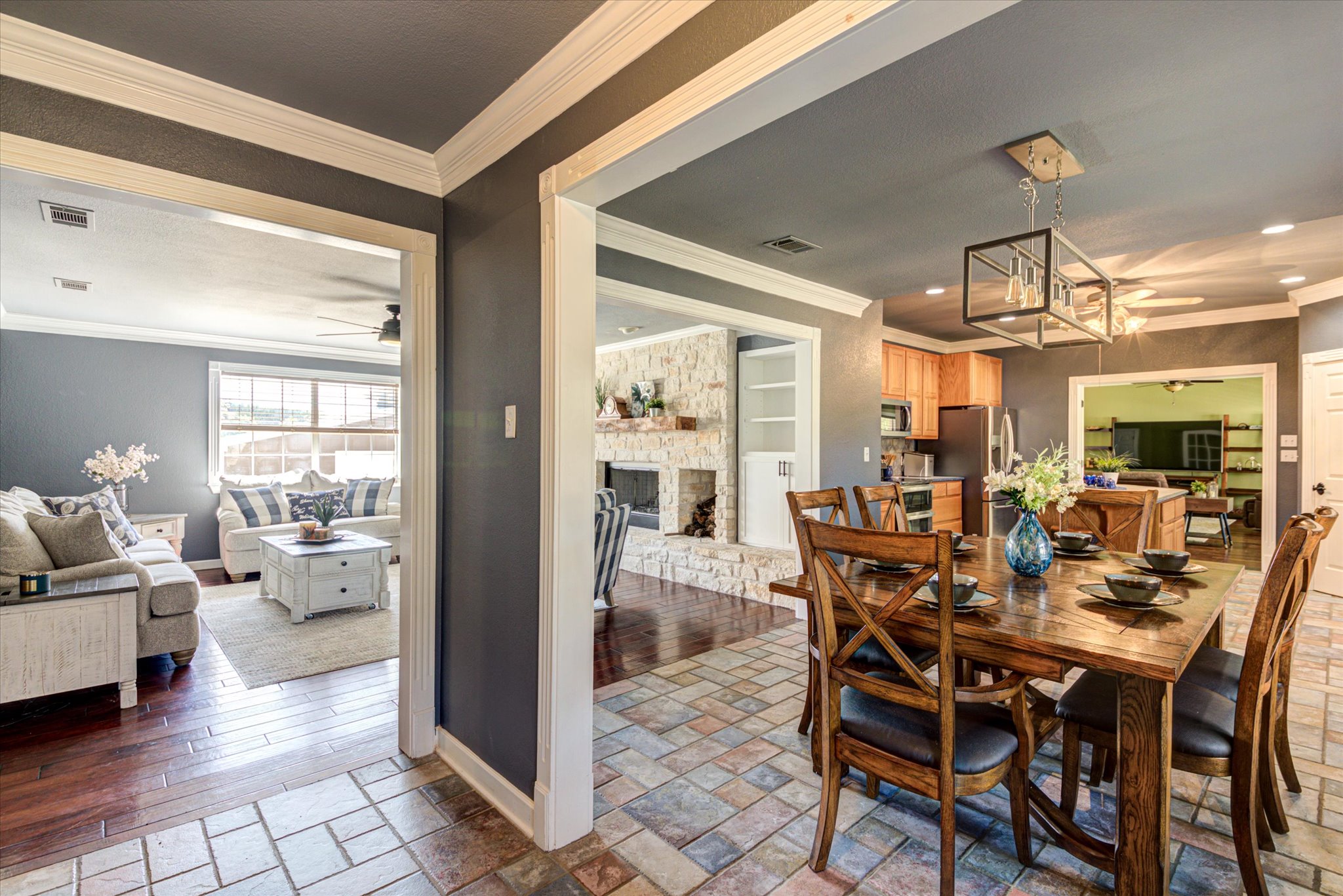 13423 Trail Driver Street Austin, TX 78737 - Photo 12 of 40 a view of a dining room with furniture and wooden floor