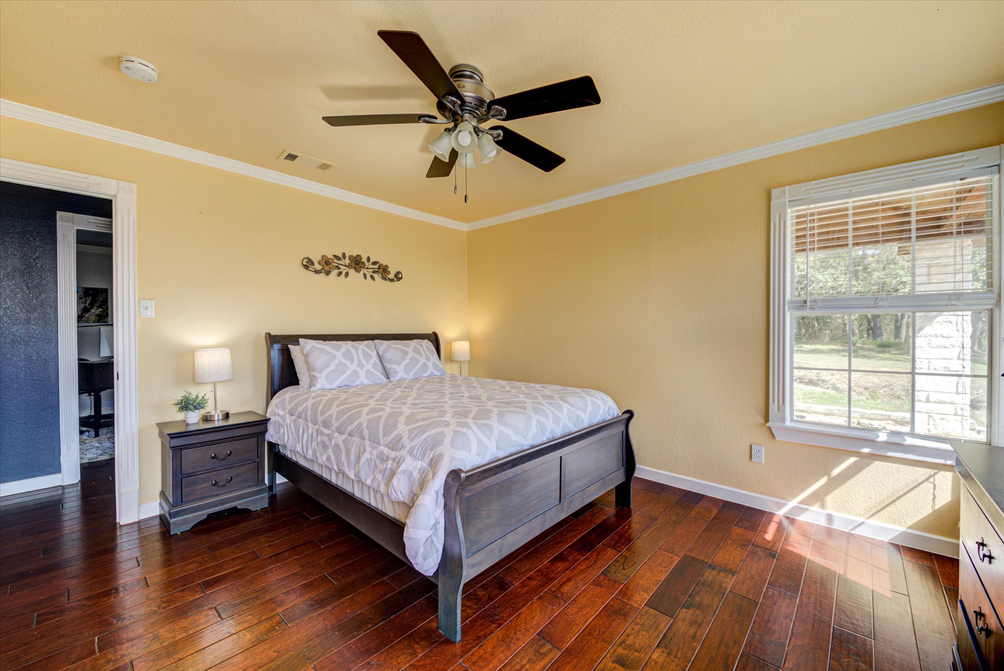 13423 Trail Driver Street Austin, TX 78737 - Photo 15 of 40 a bedroom with a bed and window