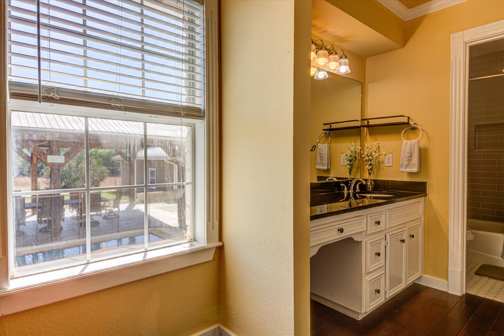 13423 Trail Driver Street Austin, TX 78737 - Photo 16 of 40 a kitchen with a window a sink and a refrigerator