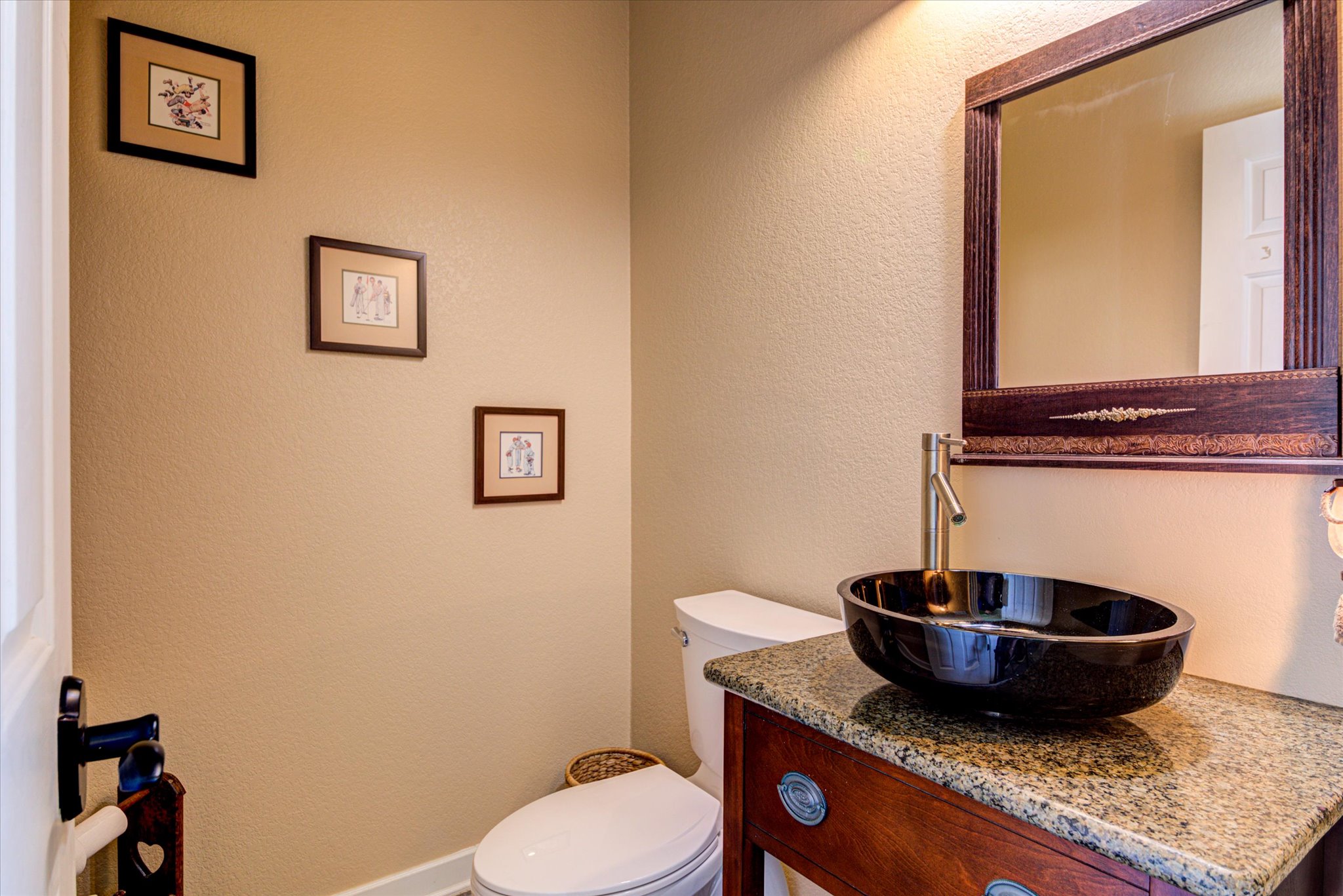 13423 Trail Driver Street Austin, TX 78737 - Photo 21 of 40 a bathroom with a granite countertop toilet and a mirror