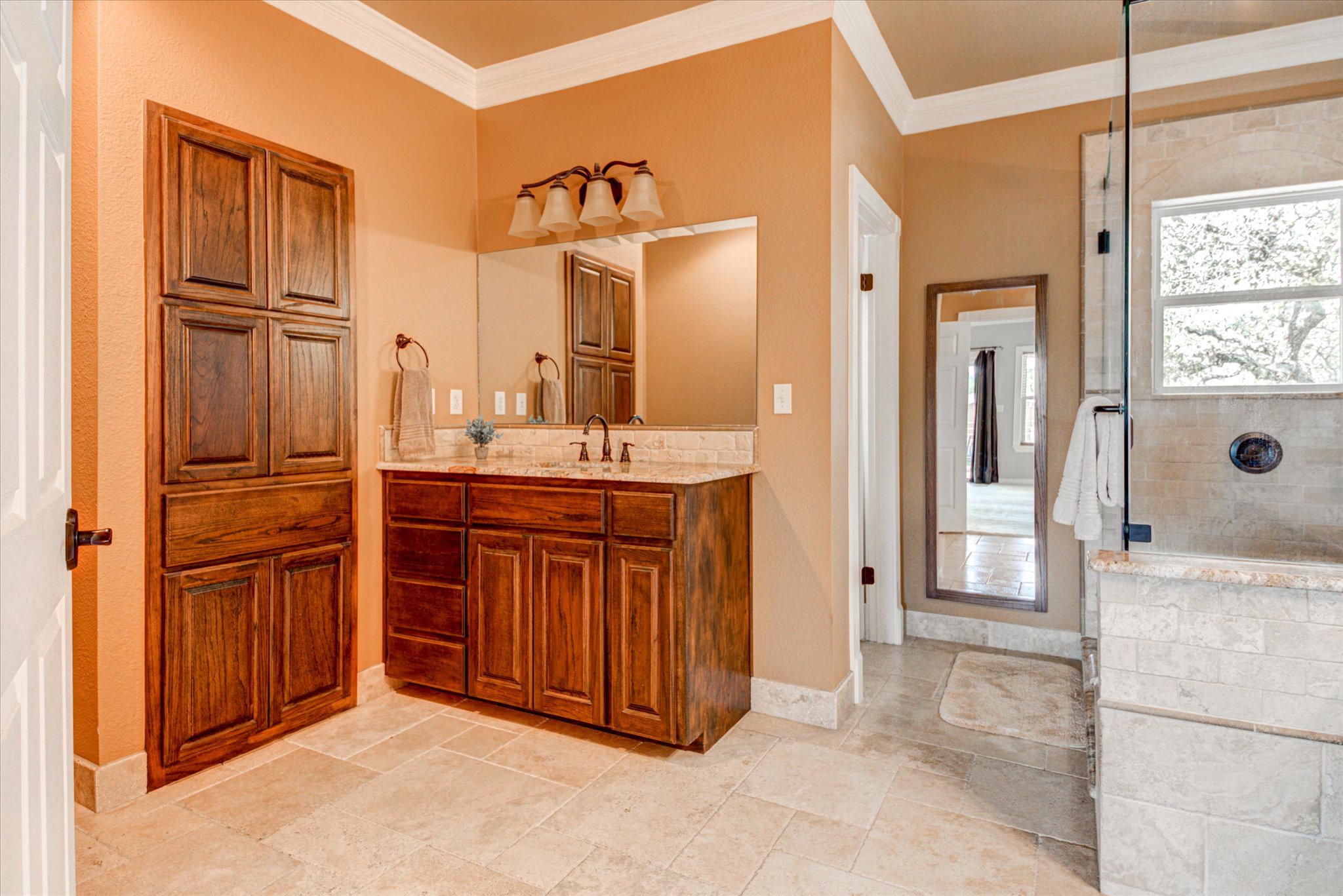 13423 Trail Driver Street Austin, TX 78737 - Photo 25 of 40 a bathroom with a granite countertop sink mirror and