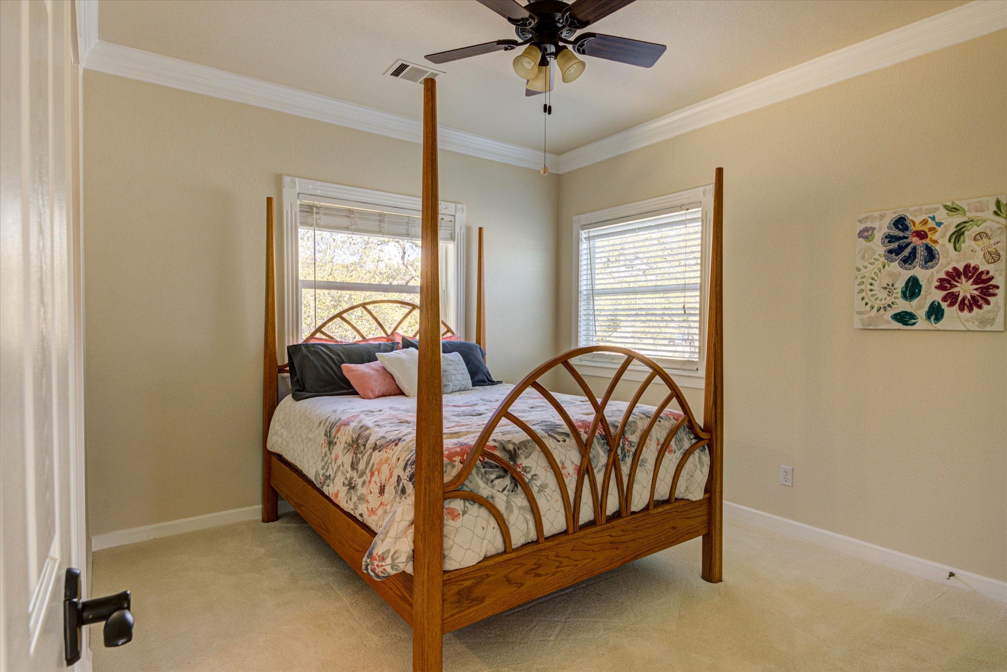 13423 Trail Driver Street Austin, TX 78737 - Photo 29 of 40 a bed sitting in a bedroom next to a window