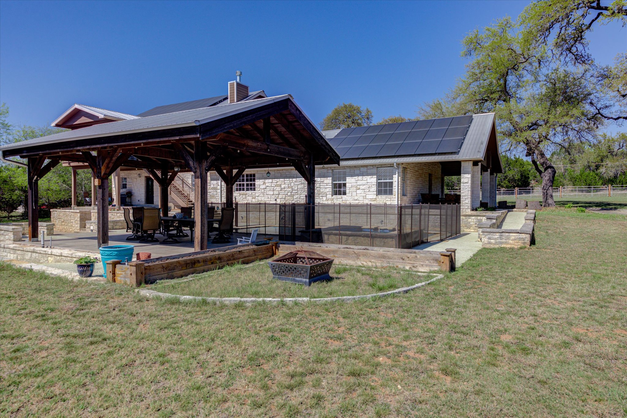13423 Trail Driver Street Austin, TX 78737 - Photo 33 of 40 a view of a house with backyard and sitting area