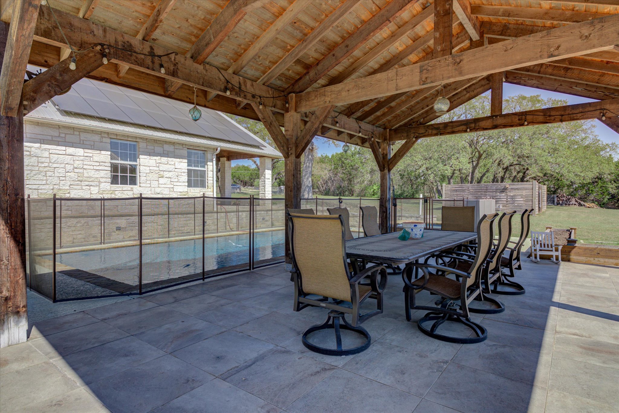 13423 Trail Driver Street Austin, TX 78737 - Photo 34 of 40 a view of a patio with table and chairs