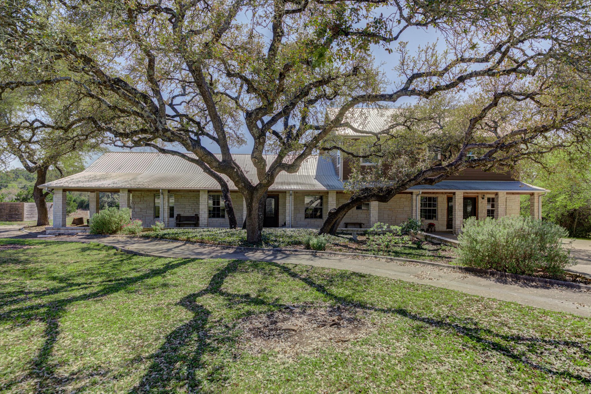 13423 Trail Driver Street Austin, TX 78737 - Photo 4 of 40 a front view of a house with garden