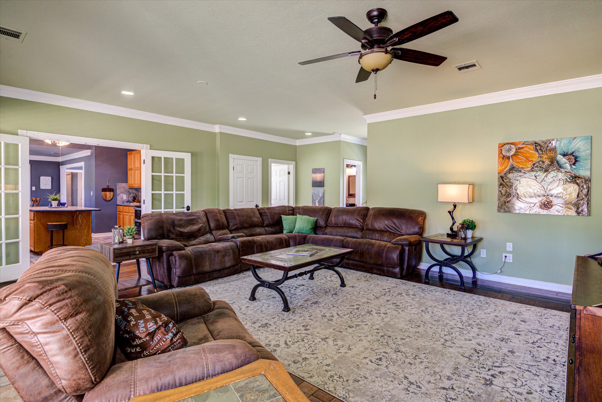 13423 Trail Driver Street Austin, TX 78737 - Photo 5 of 40 a living room with furniture a rug and a ceiling fan