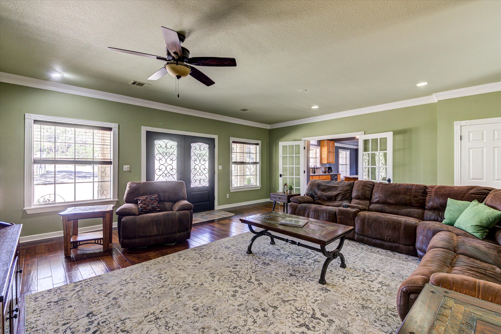 13423 Trail Driver Street Austin, TX 78737 - Photo 6 of 40 a living room with furniture flat screen tv and a window