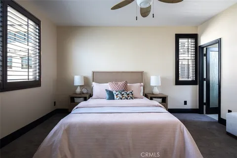 a bedroom with a bed and window