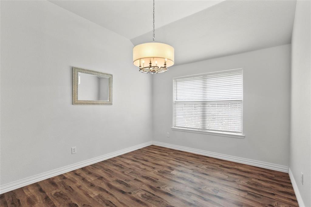 5961 Cheyenne Way Frisco, TX 75034 - Photo 5 of 33 Interior room featuring wood-finish flooring, white baseboards, and a neutral wall color
