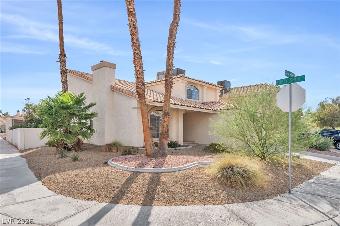 1402 Rim Fire Circle Henderson, NV 89014 - Photo 47 of 48 Desert landscaping and a tile roof define the facade of this two-story corner home.