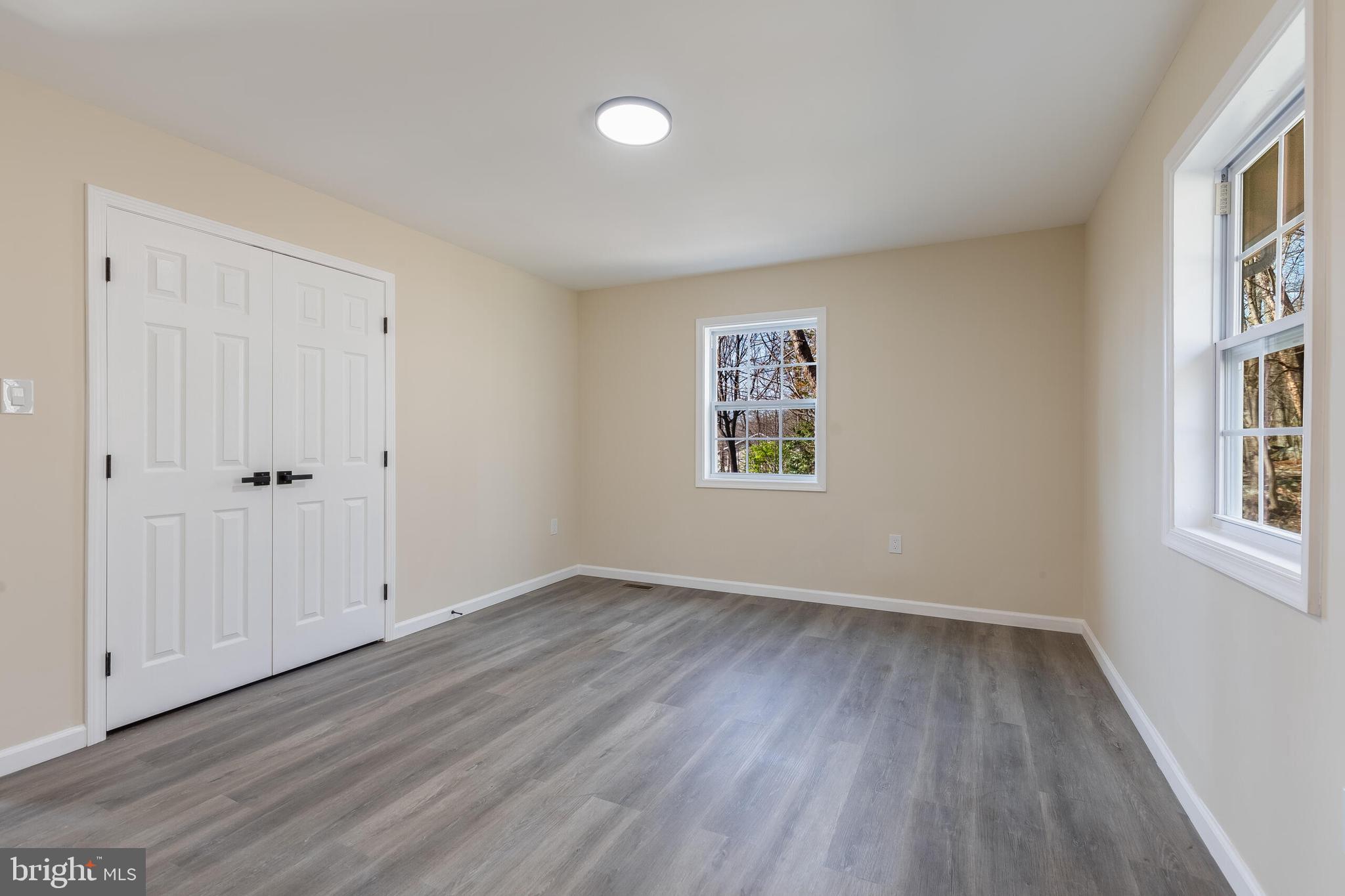 224 Hawk Trail Winchester, VA 22602 - Photo 13 of 29 wooden floor in an empty room with a window