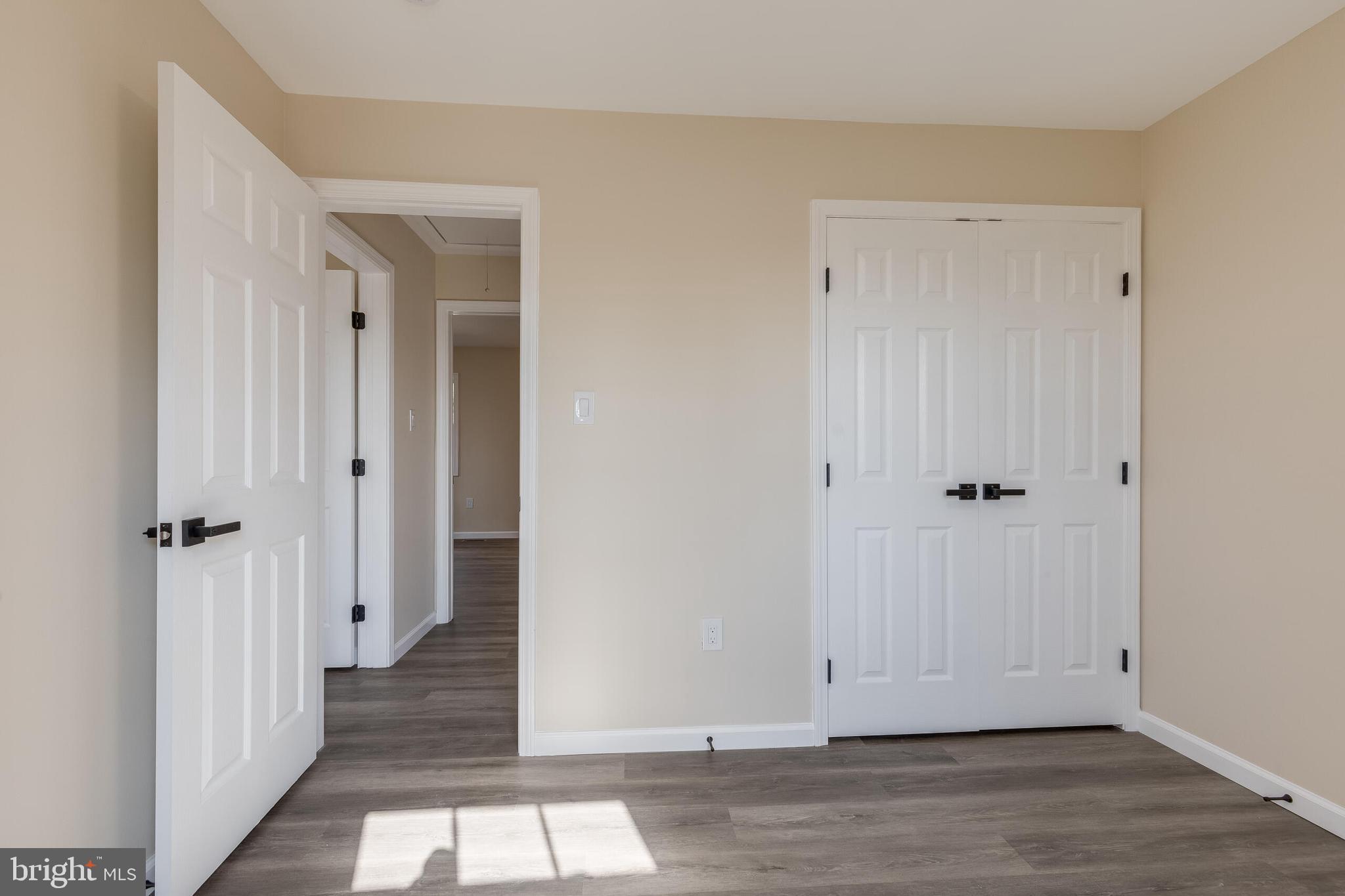 224 Hawk Trail Winchester, VA 22602 - Photo 17 of 29 a view of a hallway with wooden floor