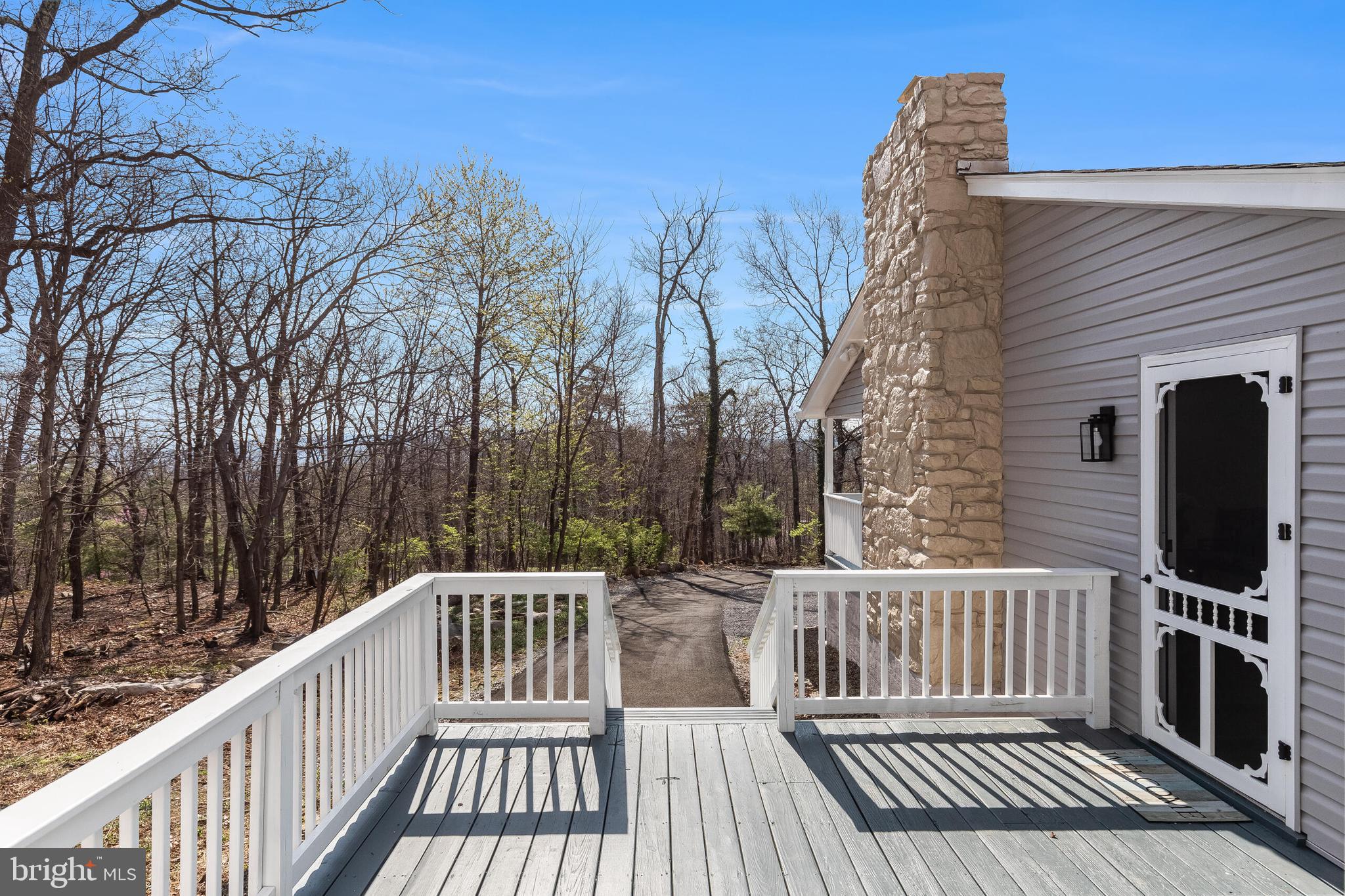 224 Hawk Trail Winchester, VA 22602 - Photo 24 of 29 a view of a wooden deck with trees