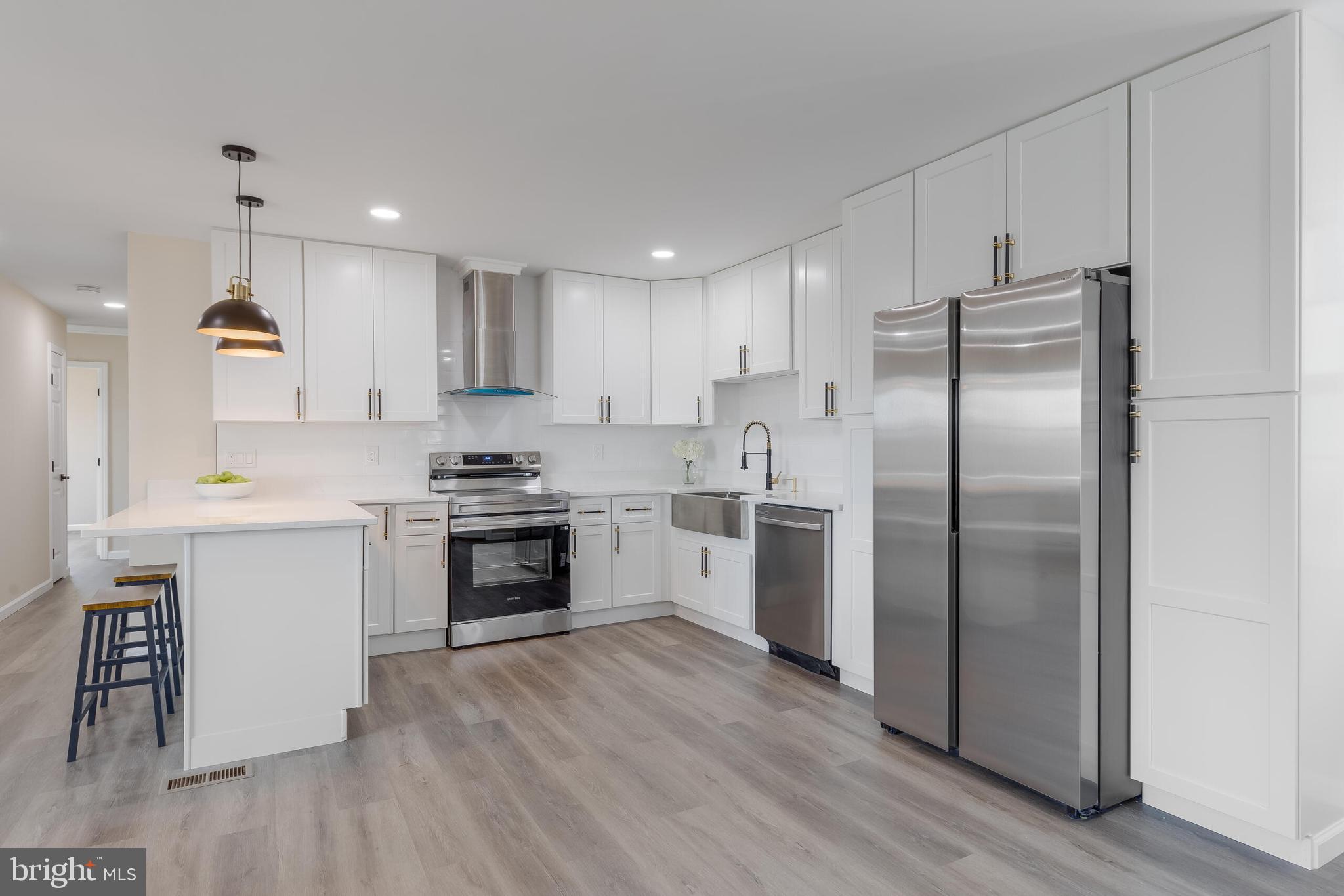 224 Hawk Trail Winchester, VA 22602 - Photo 6 of 29 a kitchen with a refrigerator sink and cabinets