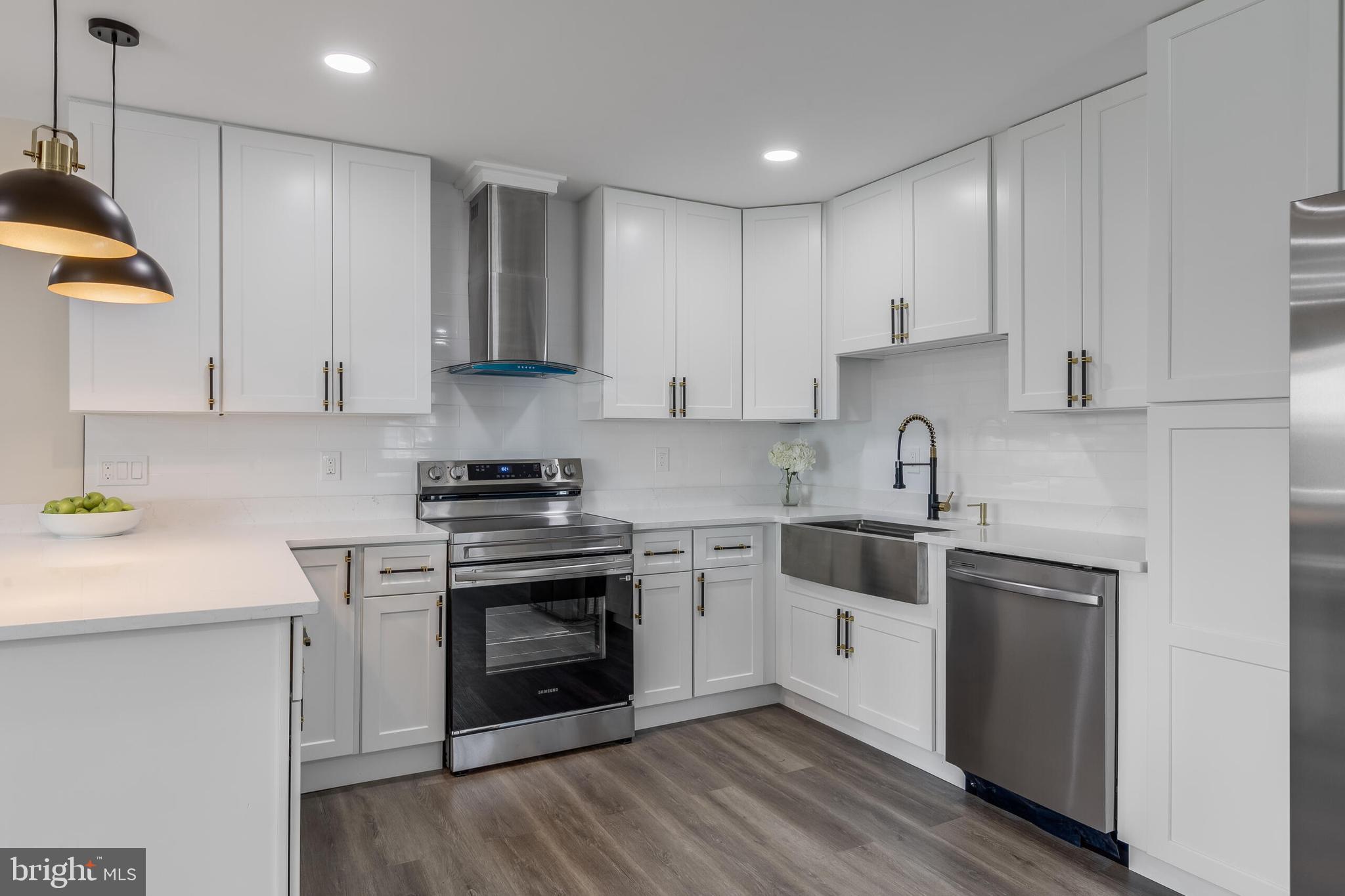 224 Hawk Trail Winchester, VA 22602 - Photo 7 of 29 a kitchen with stainless steel appliances granite countertop a stove a sink and a refrigerator
