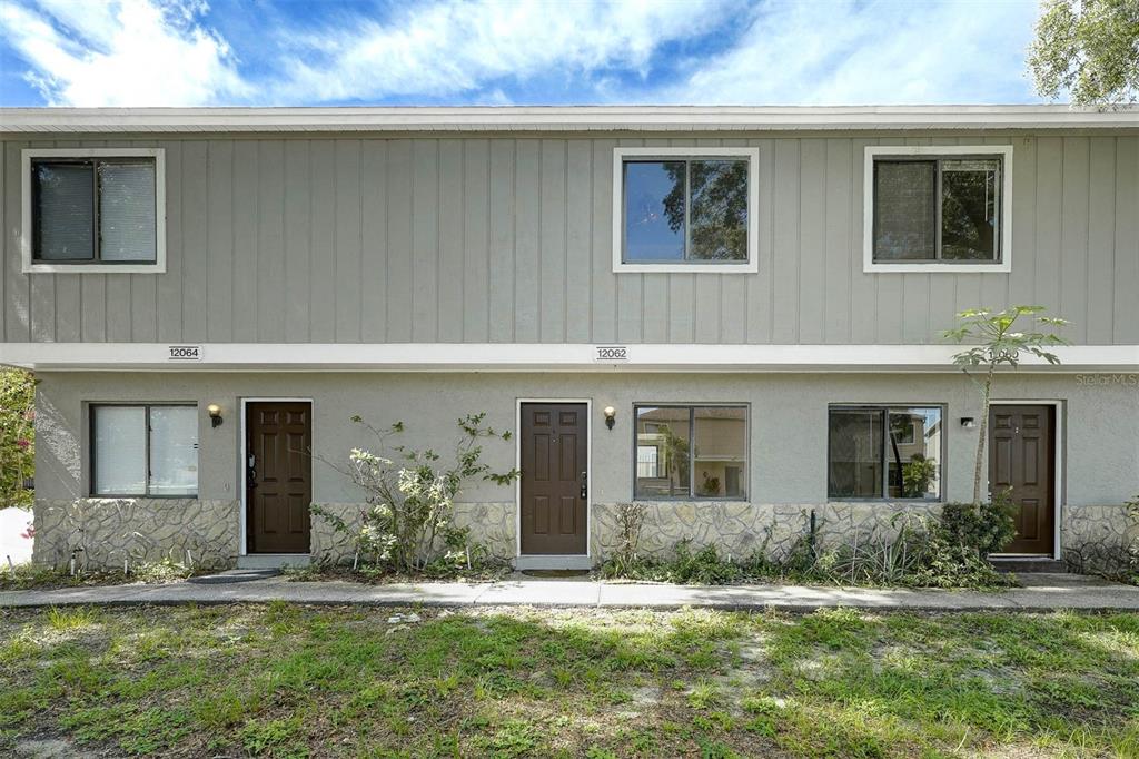 12062 Tift Circle Orlando, FL 32826 - Photo 1 of 26 a front view of house with yard