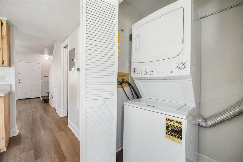 12062 Tift Circle Orlando, FL 32826 - Photo 11 of 26 a view of a hallway with washer and dryer