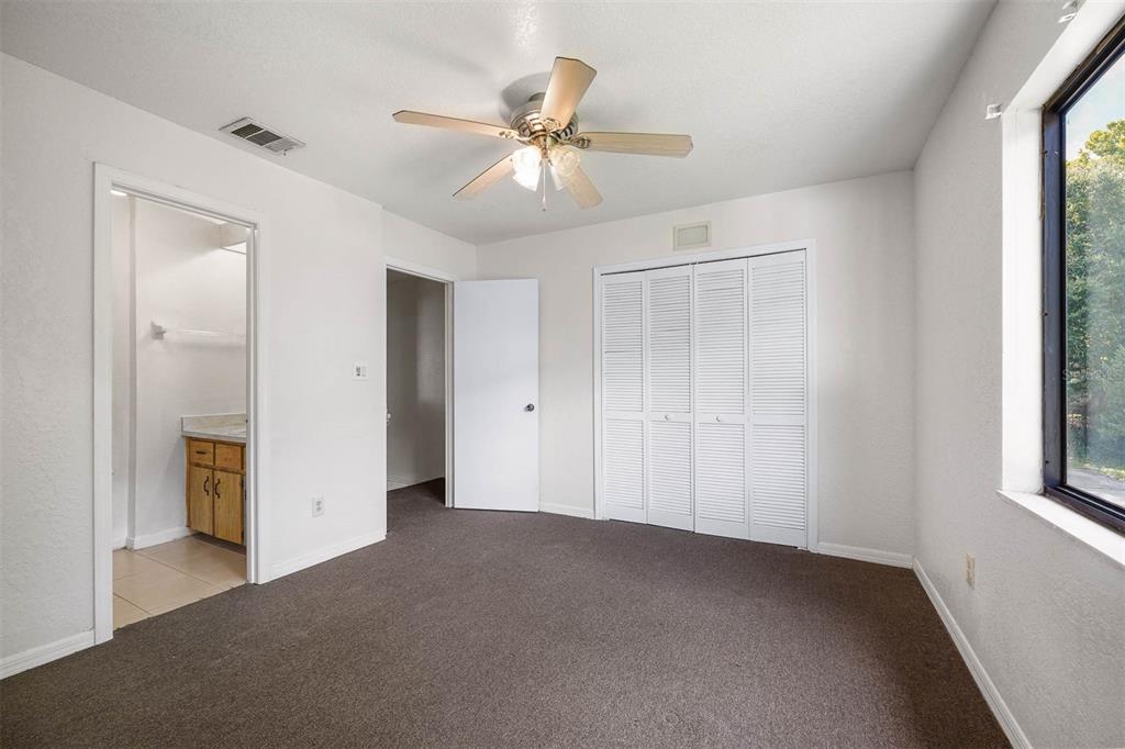 12062 Tift Circle Orlando, FL 32826 - Photo 14 of 26 a view of an empty room with a window
