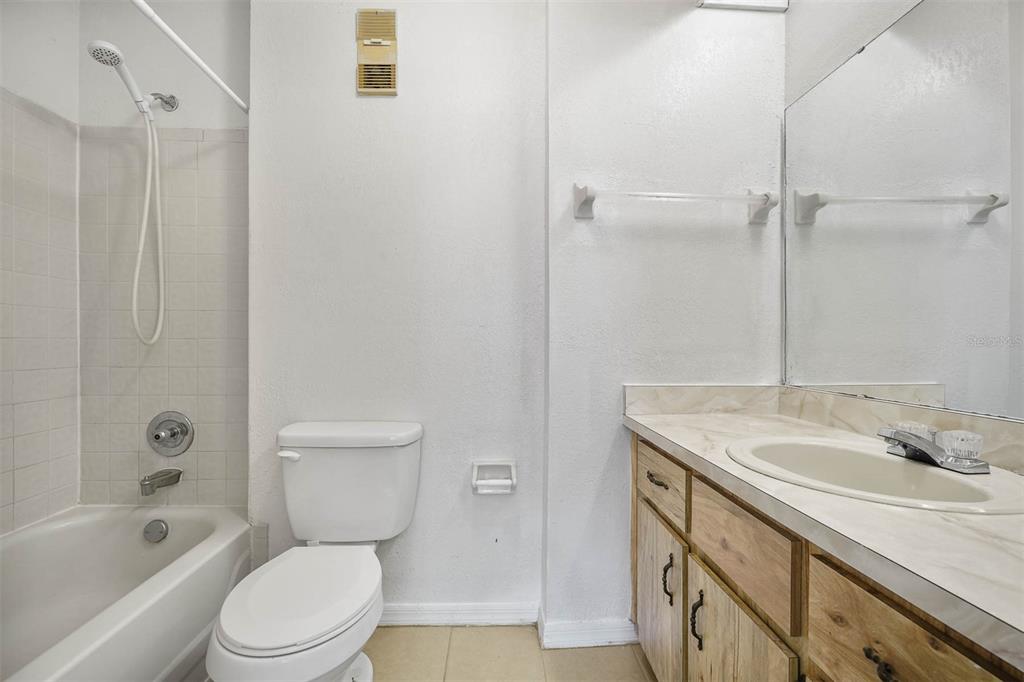 12062 Tift Circle Orlando, FL 32826 - Photo 15 of 26 a bathroom with a sink a toilet and shower