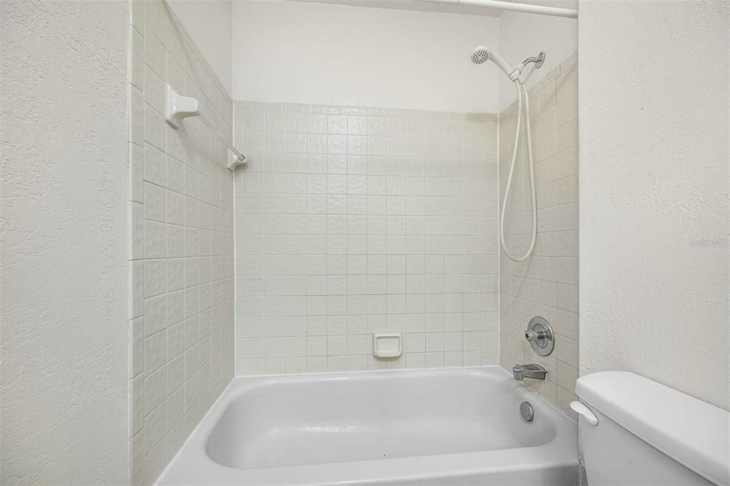 12062 Tift Circle Orlando, FL 32826 - Photo 16 of 26 a bathroom with a bathtub