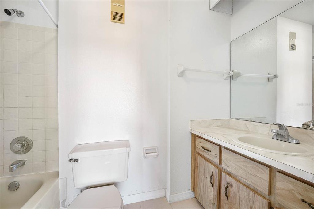 12062 Tift Circle Orlando, FL 32826 - Photo 20 of 26 a bathroom with a sink a toilet and shower
