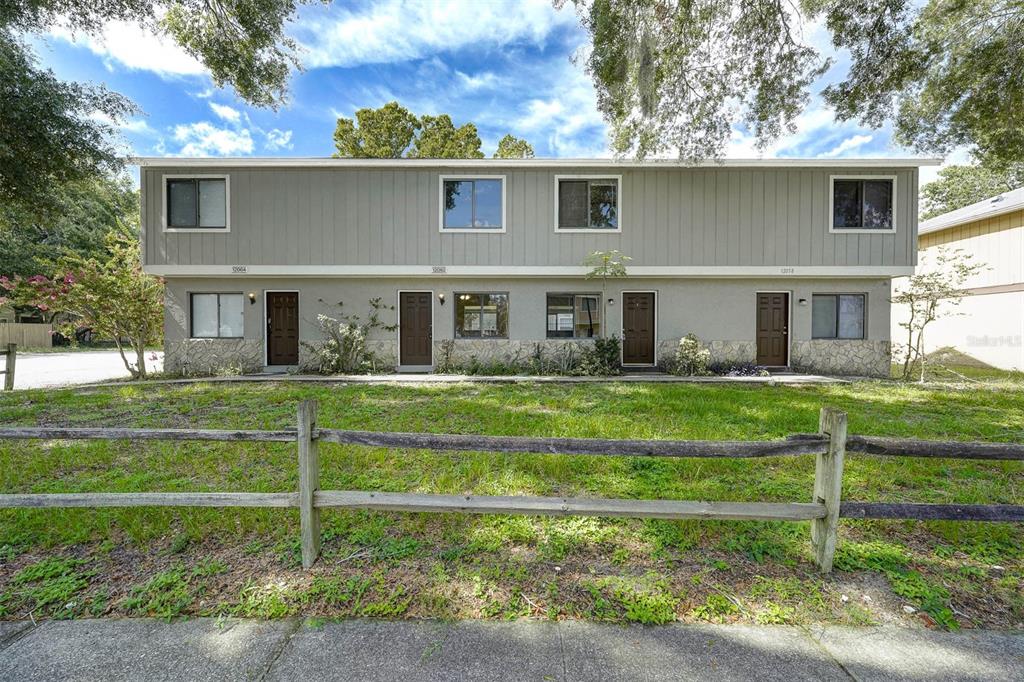 12062 Tift Circle Orlando, FL 32826 - Photo 2 of 26 a front view of a house with a yard