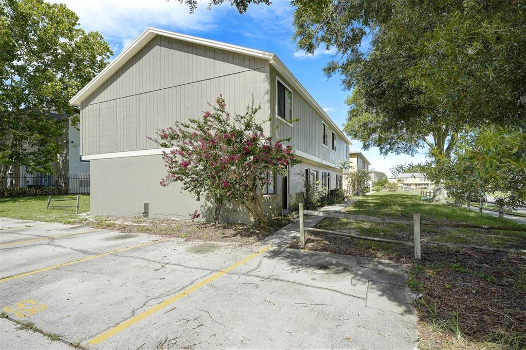 12062 Tift Circle Orlando, FL 32826 - Photo 22 of 26 a view of a house with a yard